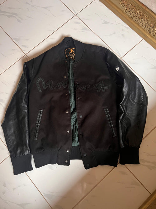 Money Clothing black varsity jacket size M second-hand, real photo, Lbass Original Morocco — front view with leather sleeves and green lining